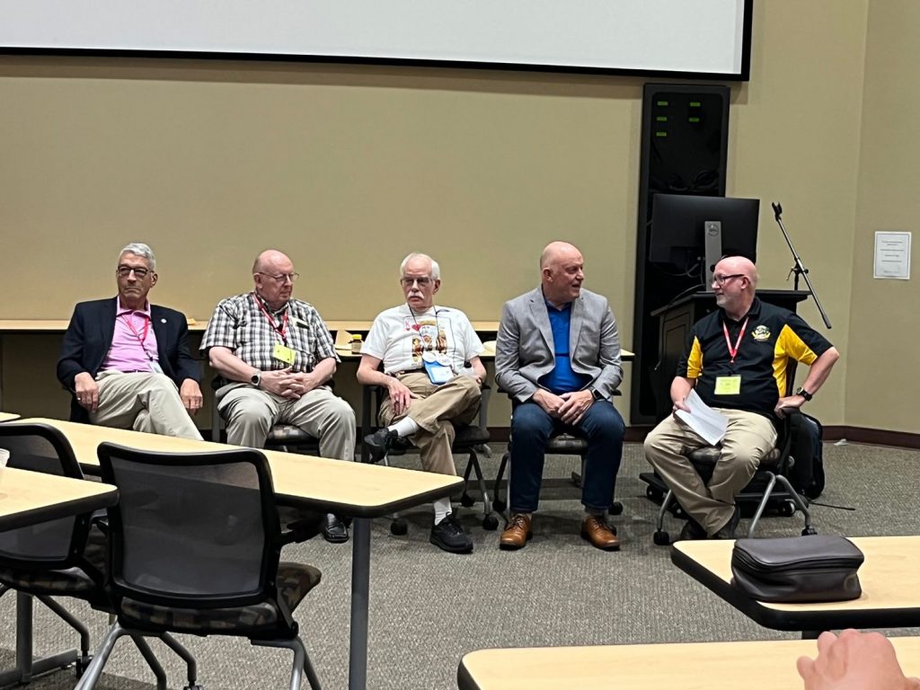 Moderator and the four members of the VM legends panel at the 50th Anniversary VM Workshop