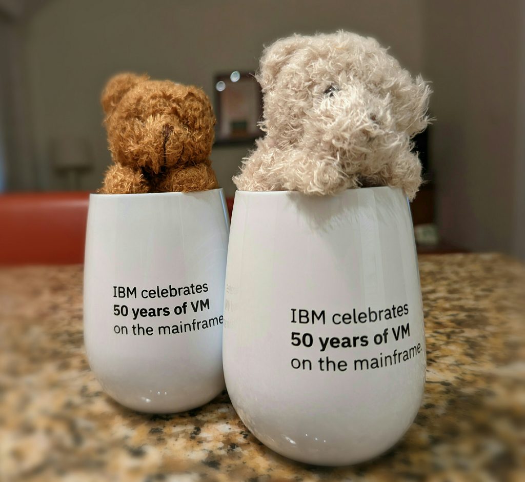 small soft teddy bears in cups with VM 50th Anniversary workshop printed on them
